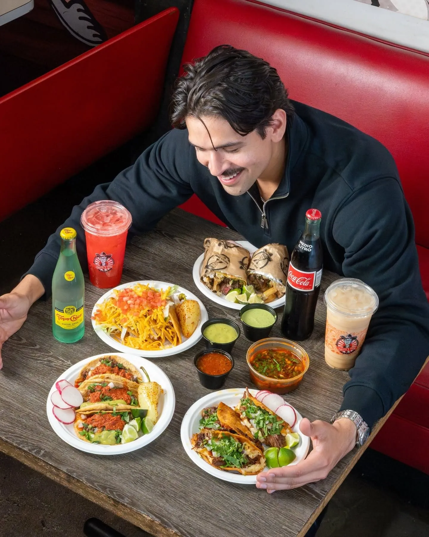 A table of Pablito's tacos, plates and aguas frescas in Burbank