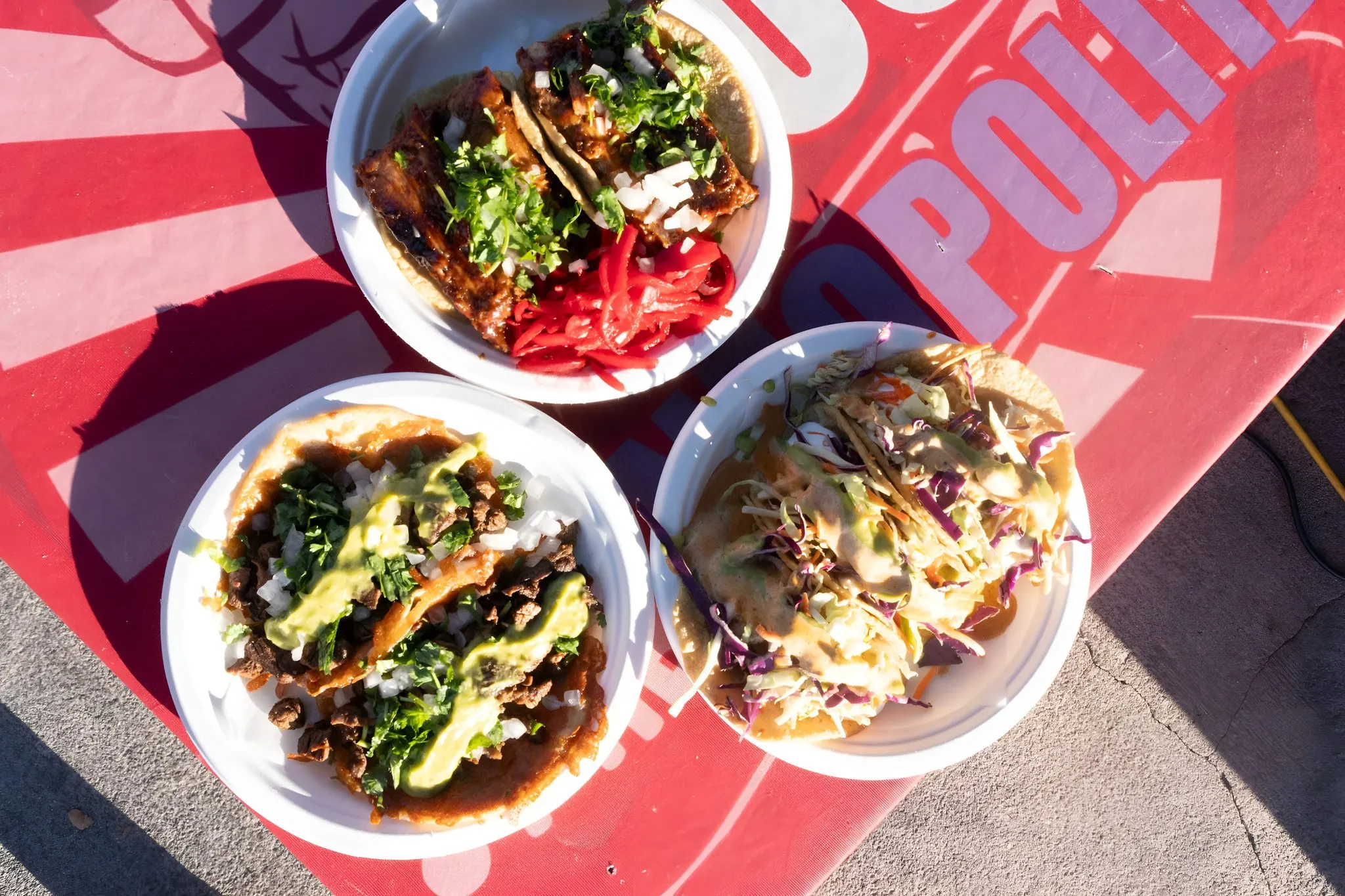 Pablito's tacos and lomo saltado on the red sunburst table